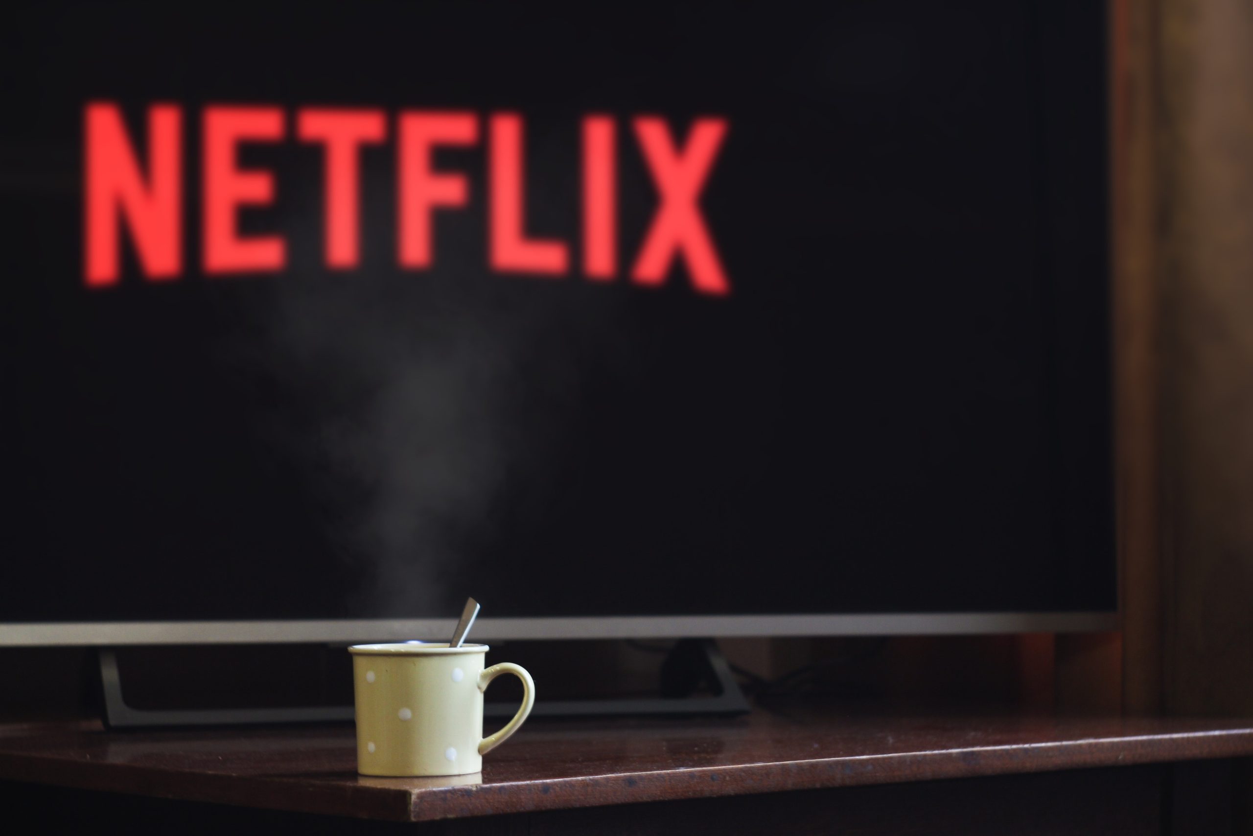 Coffee mug and Netflix in front of TV